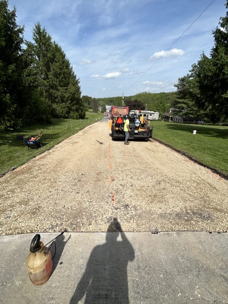 Construction workers on gravel road